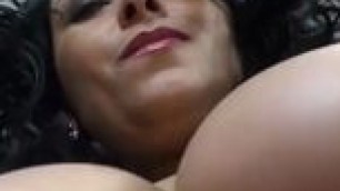 Latin mature woman showing her big boobs