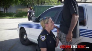 Blonde cop riding a big black dick in the street