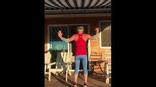 fit septuagenarian woman dancing on her deck
