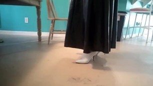 Crossdresser in White Leather Boots with Long Leather Skirt