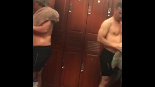 Sexy businessman naked in locker room after gym workout